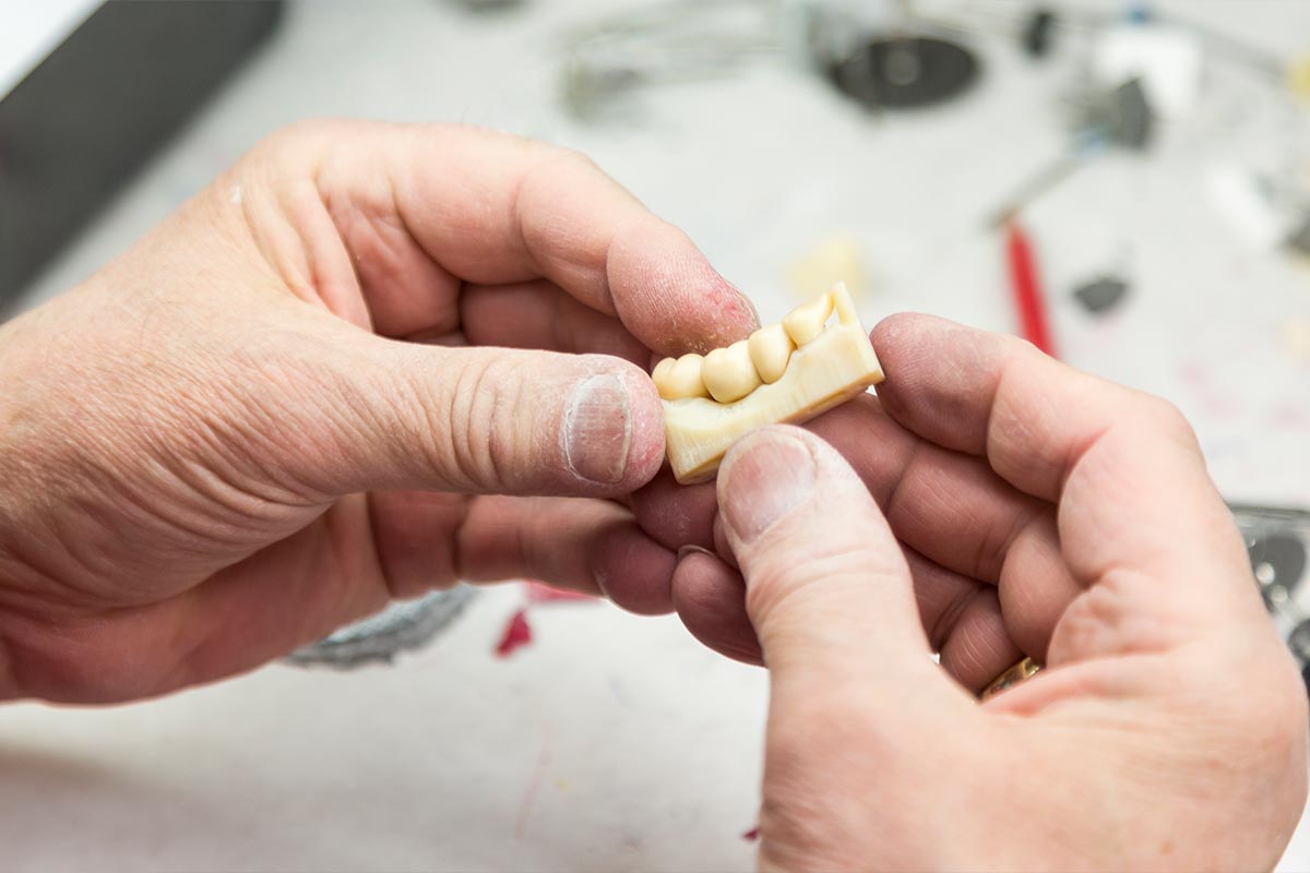 male-dental-technician-working-on-a-3d-printed-mol-2024-09-11-06-10-46-utc